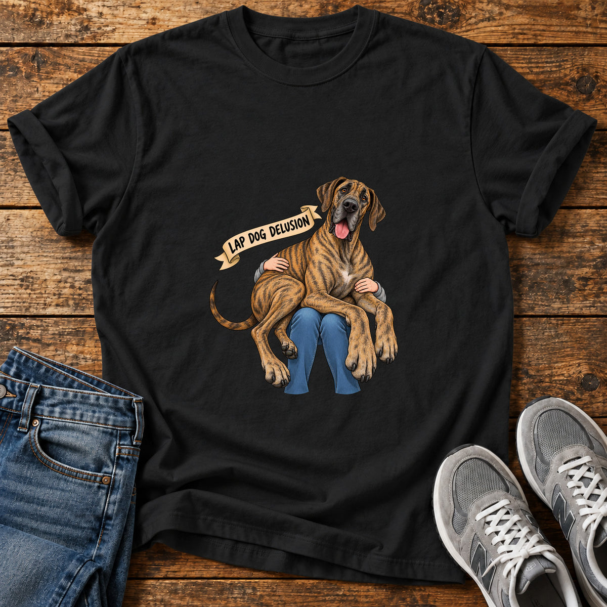 Lap Dog Delusion Great Dane graphic T-shirt in Black, shown on a flat-lay shirt mockup