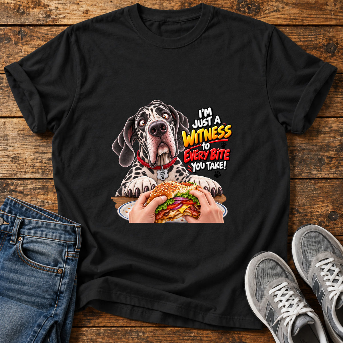 Witness Every Bite Great Dane graphic T-shirt in Black, shown on a flat-lay shirt mockup
