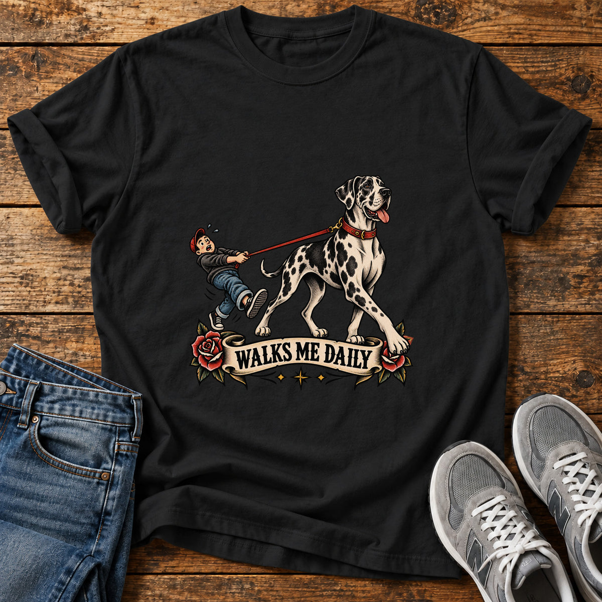 Walks Me Daily Great Dane graphic T-shirt in Black, shown on a flat-lay shirt mockup