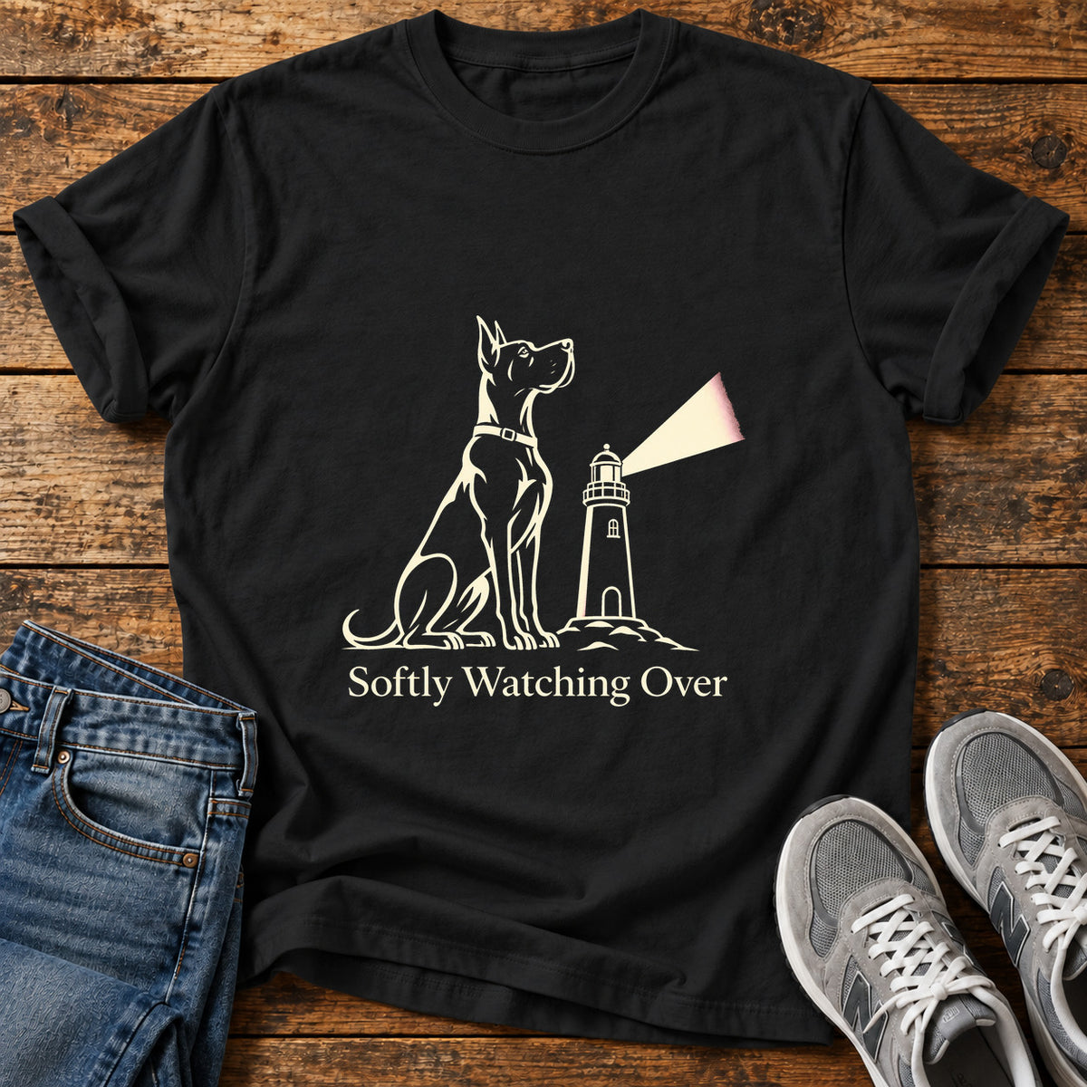 Softly Watching Over Great Dane graphic T-shirt in Black, shown on a flat-lay shirt mockup