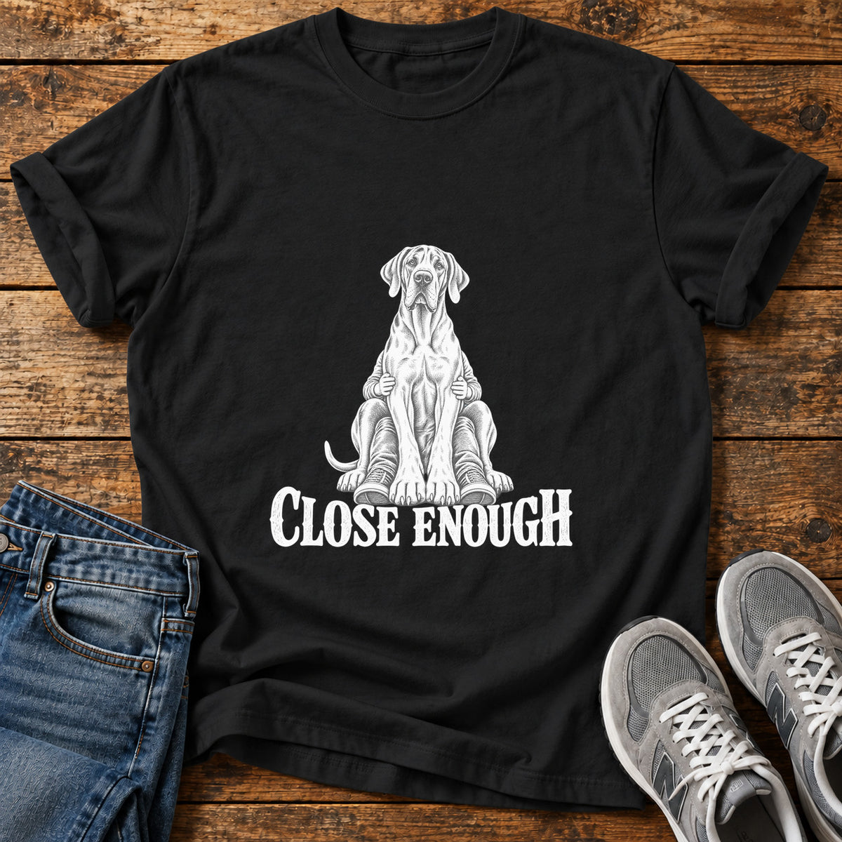 Close Enough Great Dane graphic T-shirt in Black, shown on a flat-lay shirt mockup