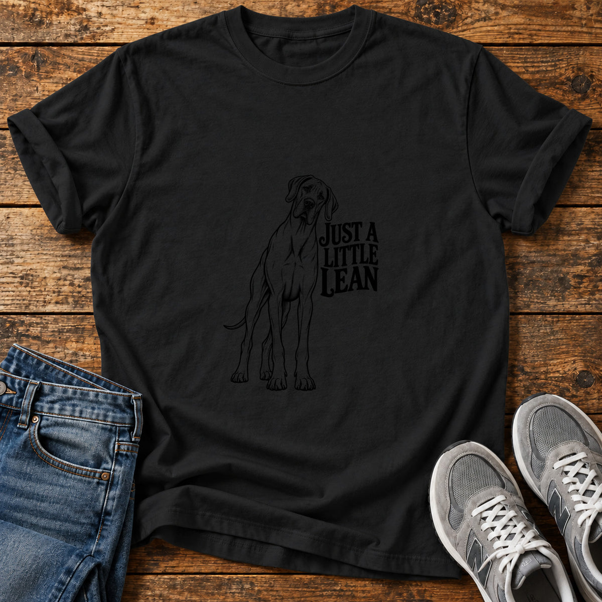 Just A Lean Great Dane graphic T-shirt in Black, shown on a flat-lay shirt mockup