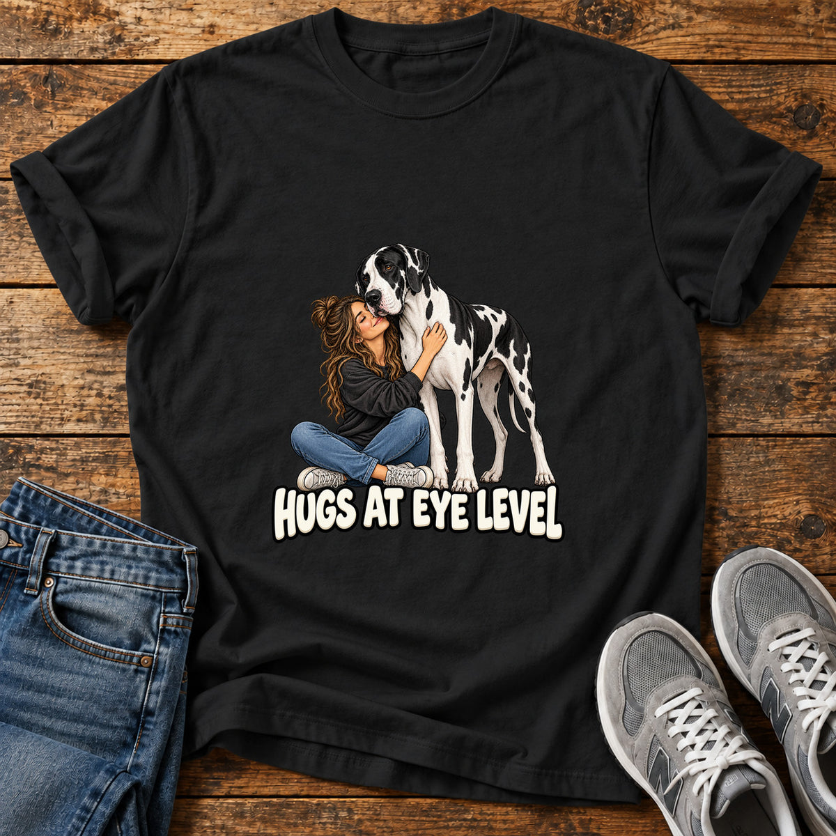 Hugs At Eye Great Dane graphic T-shirt in Black, shown on a flat-lay shirt mockup
