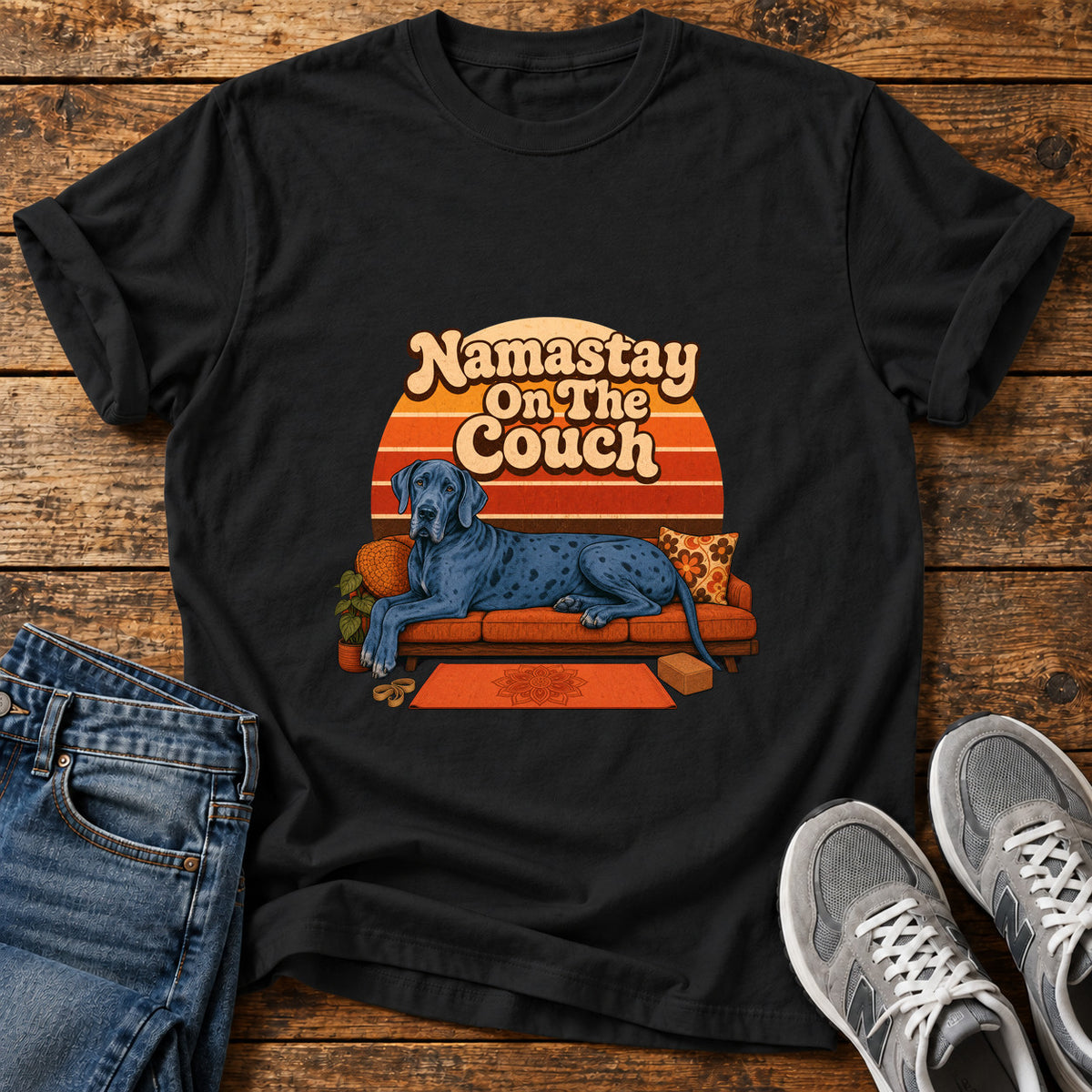 Namastay Couch Pooch Great Dane graphic T-shirt in Black, shown on a flat-lay shirt mockup