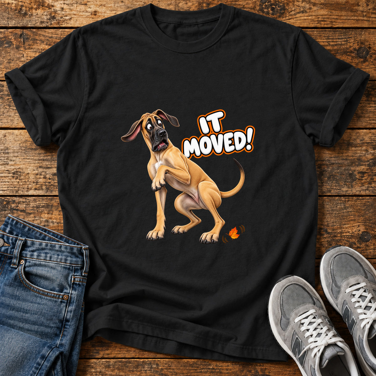 It Moved Great Dane graphic T-shirt in Black, shown on a flat-lay shirt mockup