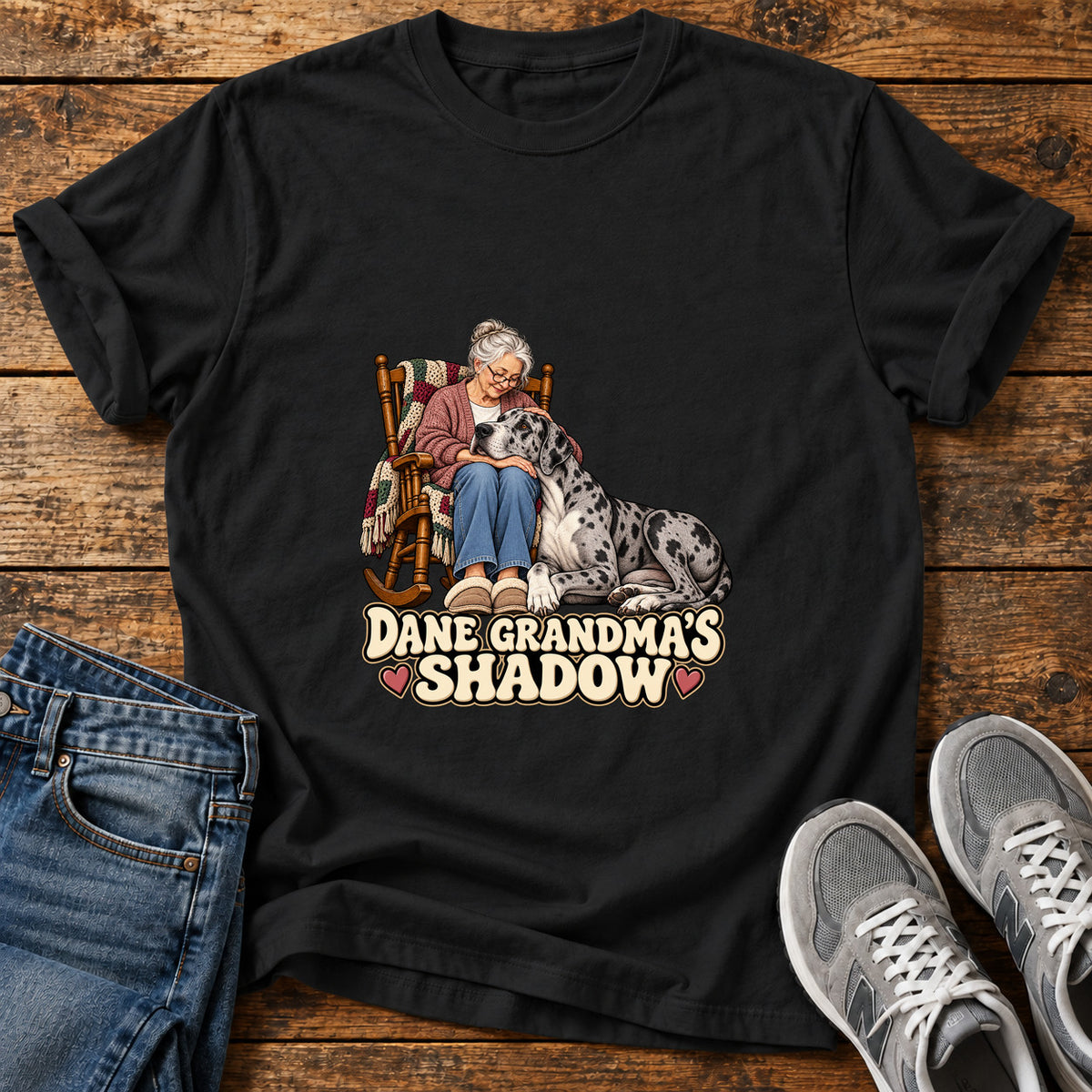 Dane Grandma's Shadow Great Dane graphic T-shirt in Black, shown on a flat-lay shirt mockup