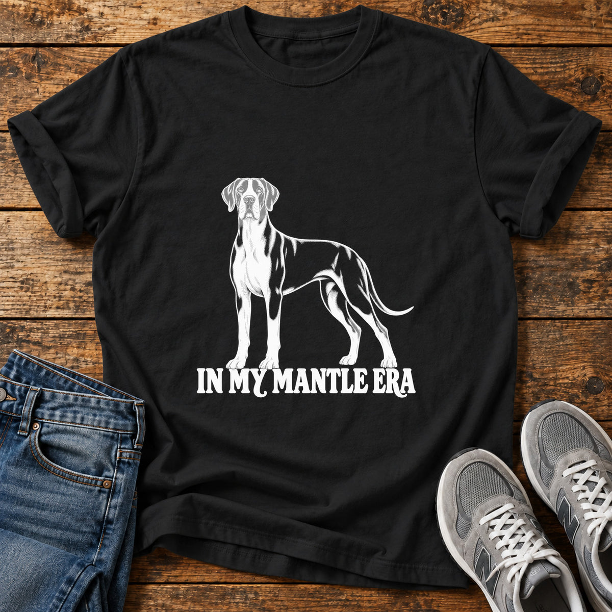 Mantle Era Great Dane graphic T-shirt in Black, shown on a flat-lay shirt mockup