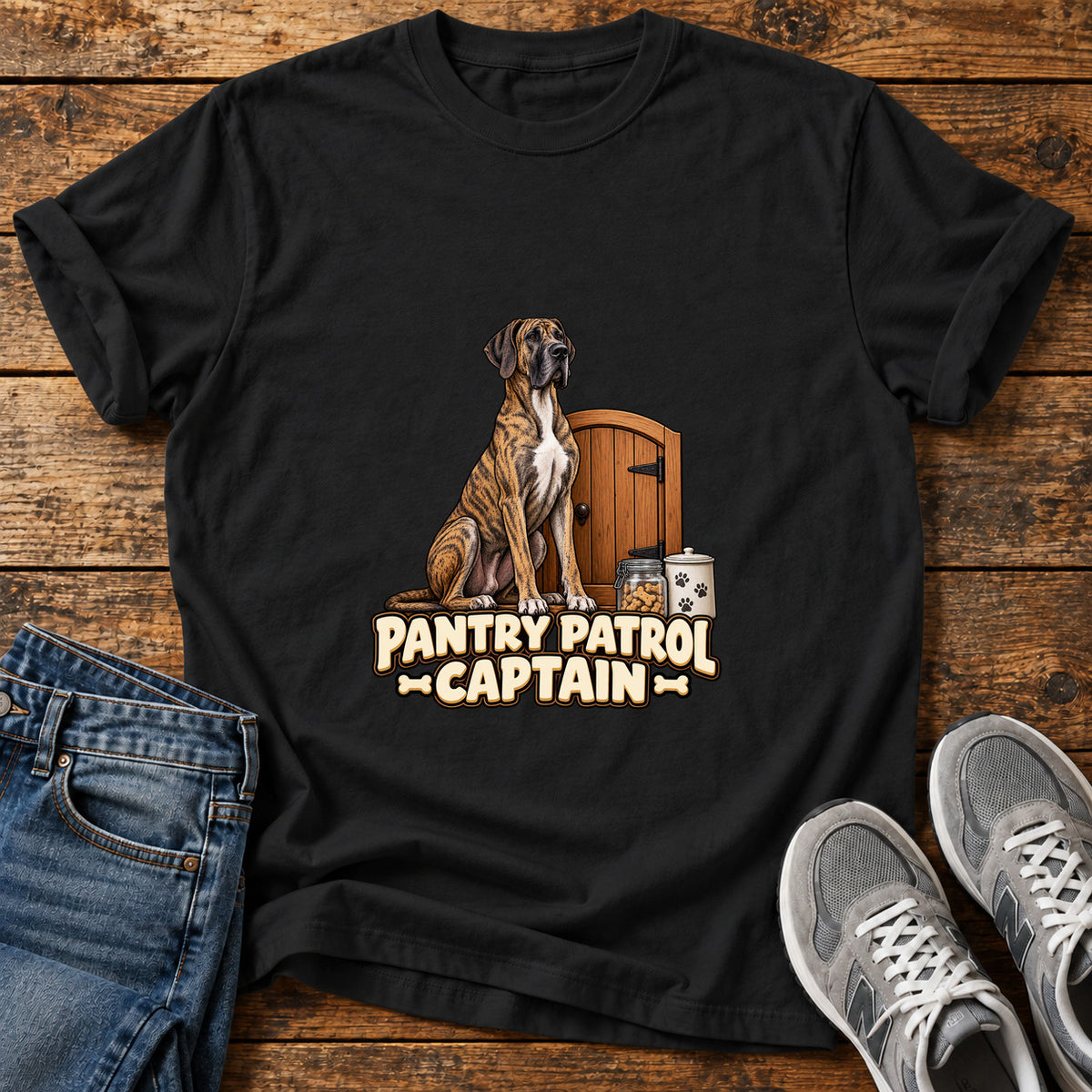 Pantry Patrol Captain Great Dane graphic T-shirt in Black, shown on a flat-lay shirt mockup
