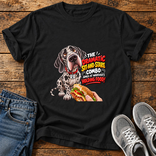 Dramatic Sit-Stare Great Dane graphic T-shirt in Black, shown on a flat-lay shirt mockup
