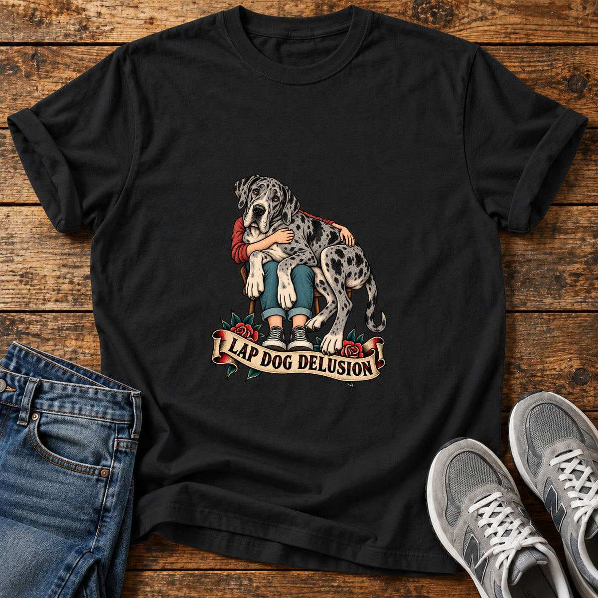 Lap Dog Delusion Great Dane graphic T-shirt in Black, shown on a flat-lay shirt mockup
