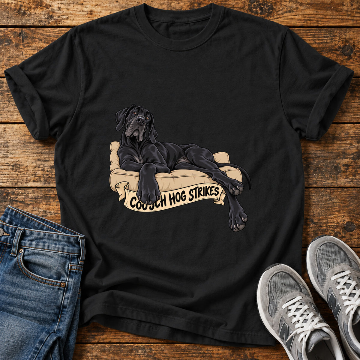 Couch Hog Strikes Great Dane graphic T-shirt in Black, shown on a flat-lay shirt mockup