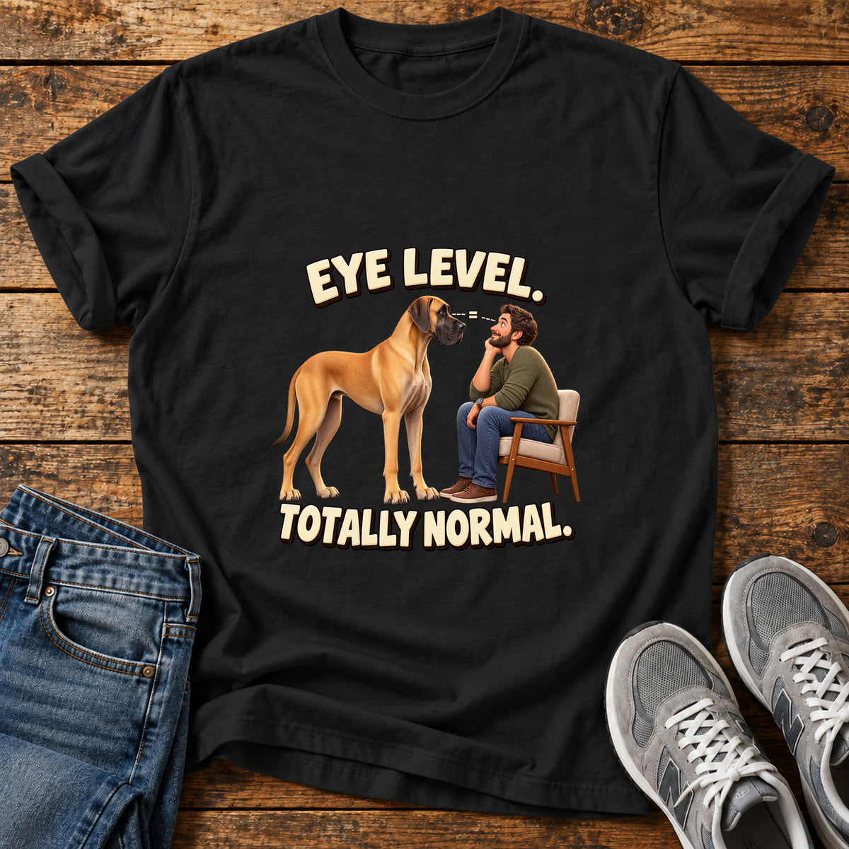 Eye Level Normal Great Dane graphic T-shirt in Black, shown on a flat-lay shirt mockup