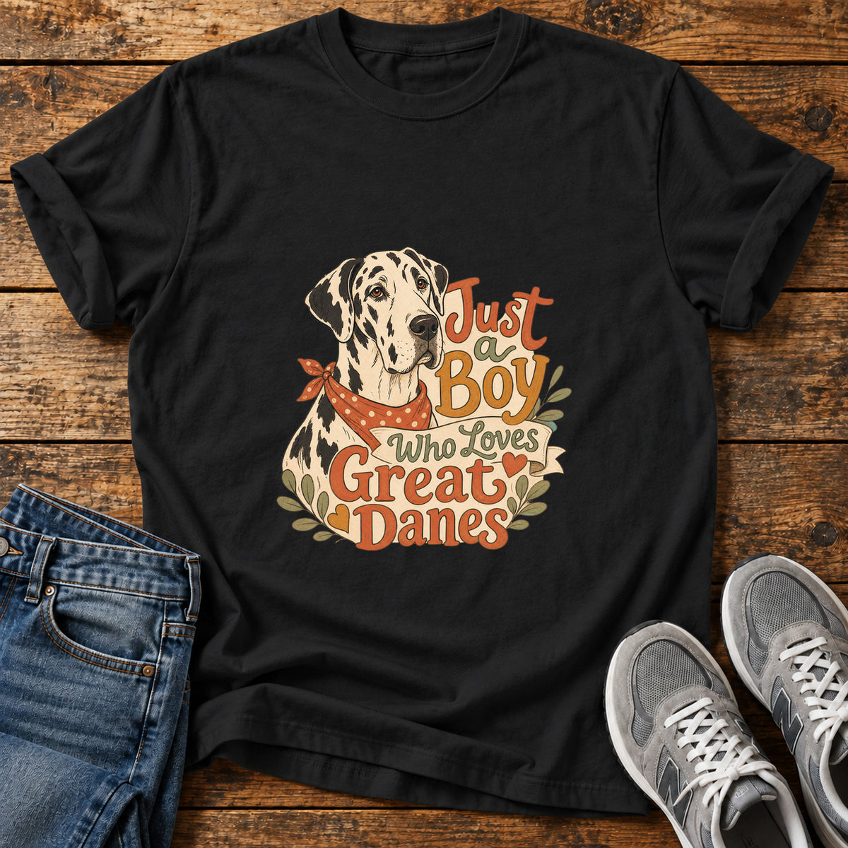 Just a Boy Great Dane graphic T-shirt in Black, shown on a flat-lay shirt mockup