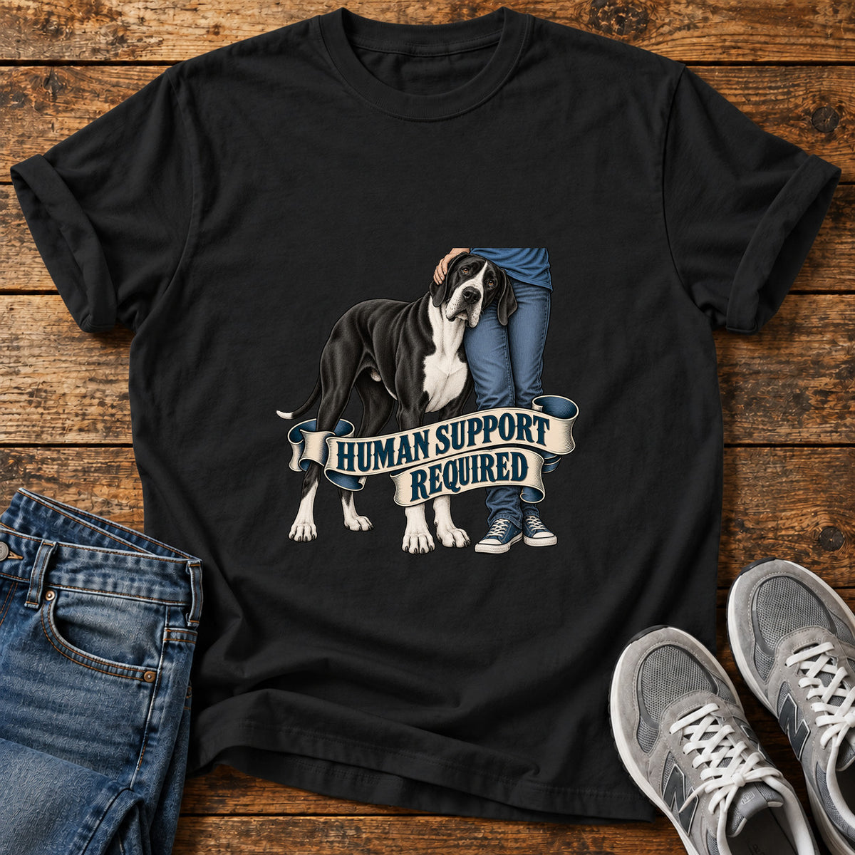 Human Support Required Great Dane graphic T-shirt in Black, shown on a flat-lay shirt mockup