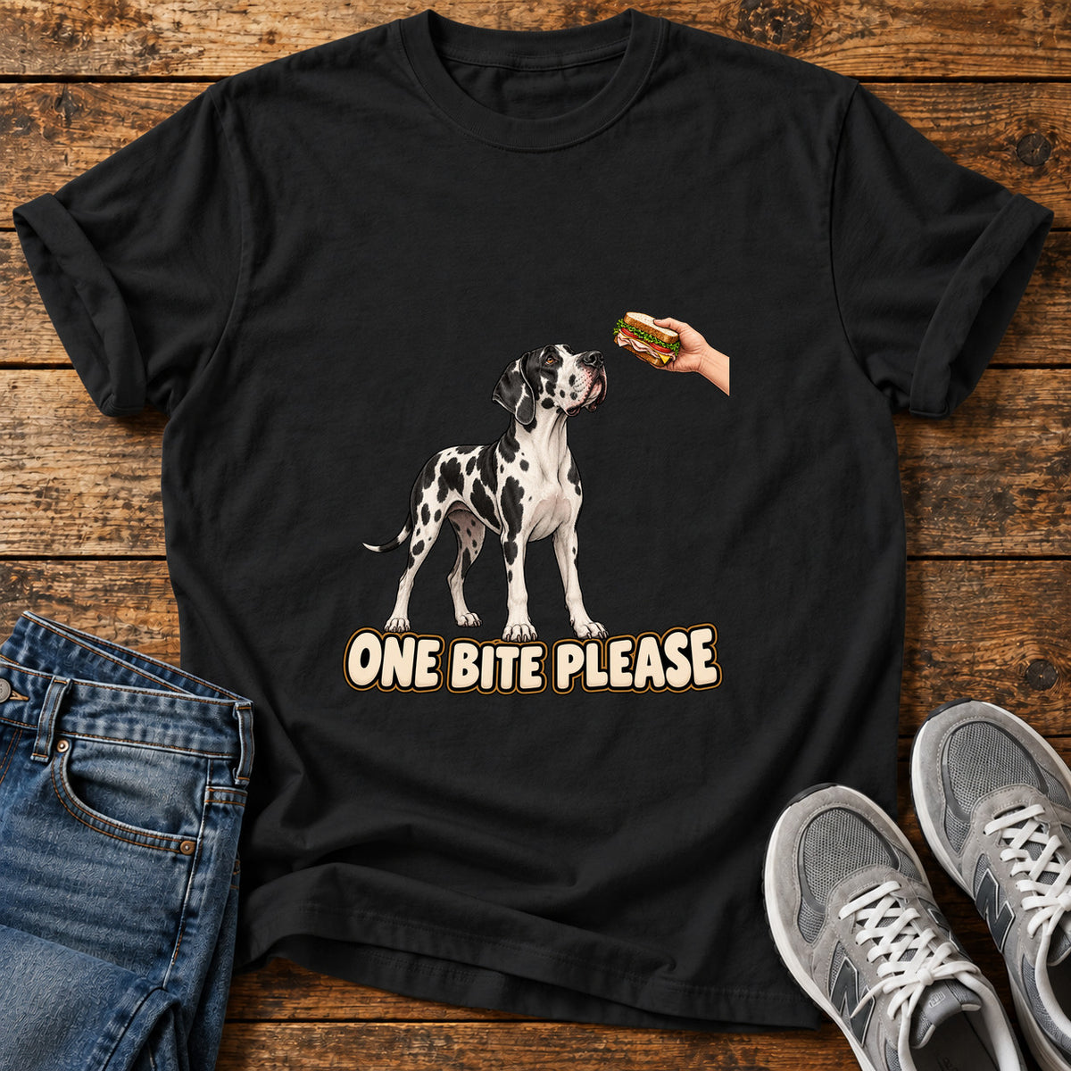 One Bite Please Great Dane graphic T-shirt in Black, shown on a flat-lay shirt mockup