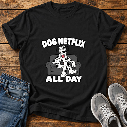 Dog Netflix Day Great Dane graphic T-shirt in Black, shown on a flat-lay shirt mockup