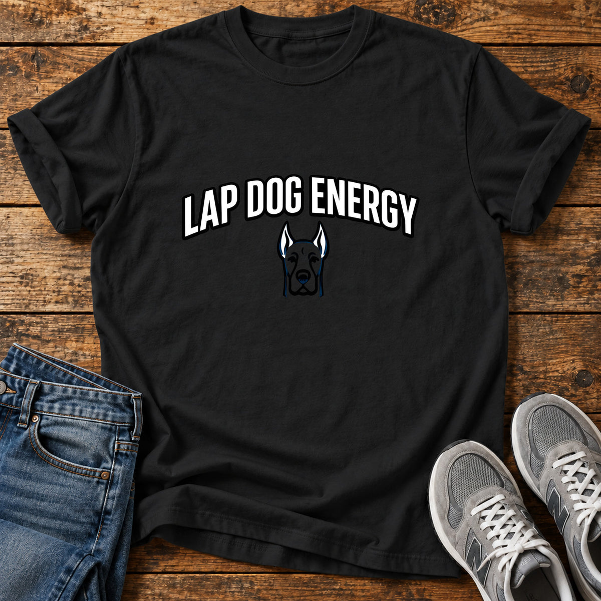 Lap Dog Energy Great Dane graphic T-shirt in Black, shown on a flat-lay shirt mockup