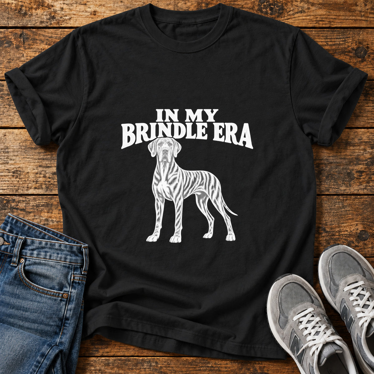 Brindle Era Great Dane graphic T-shirt in Black, shown on a flat-lay shirt mockup