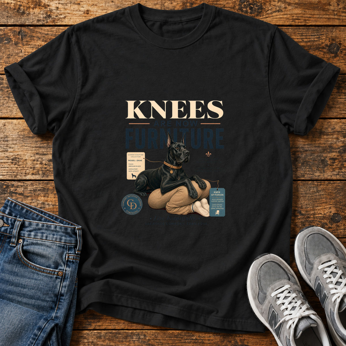 Knees Furniture Great Dane graphic T-shirt in Black, shown on a flat-lay shirt mockup