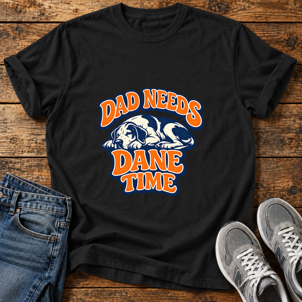 Dad Needs Dane Great Dane graphic T-shirt in Black, shown on a flat-lay shirt mockup
