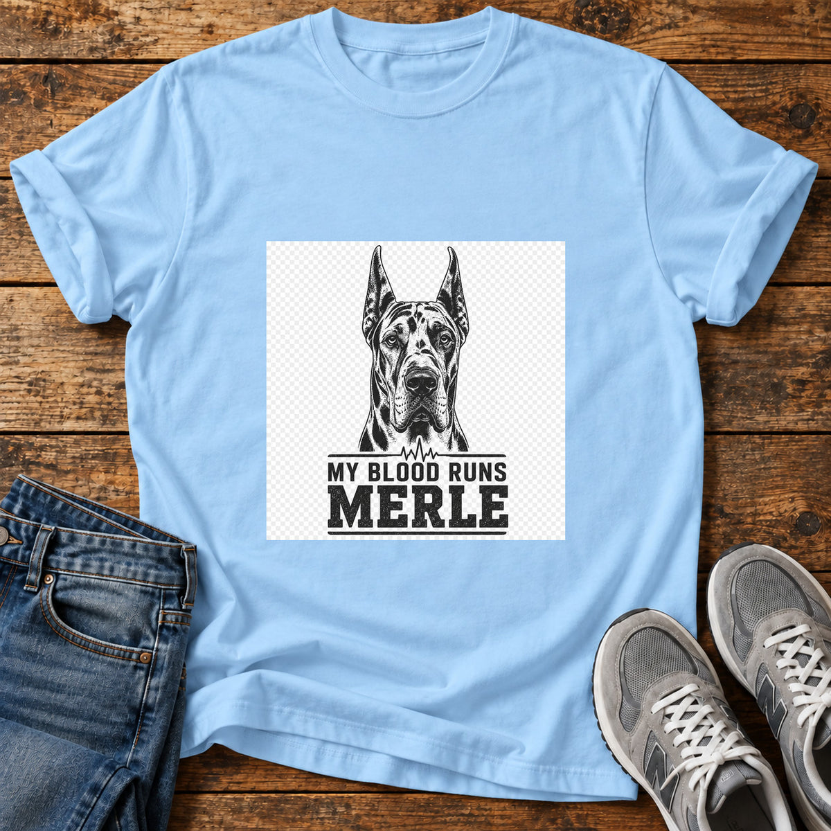 Blood Runs Merle Great Dane graphic T-shirt in Light Blue, shown on a flat-lay shirt mockup