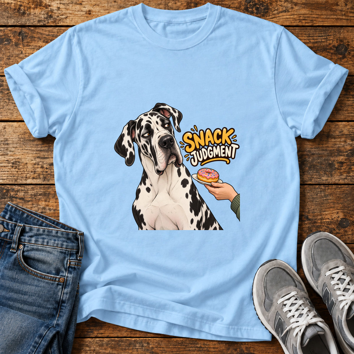 Snack Judgment Great Dane graphic T-shirt in Light Blue, shown on a flat-lay shirt mockup