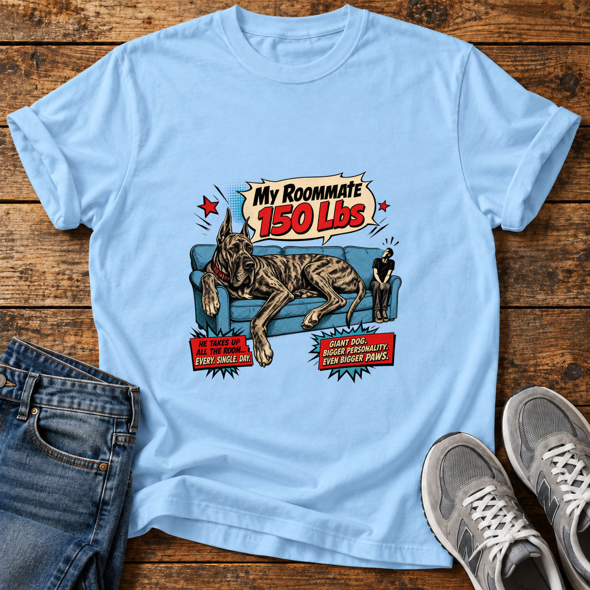 My Roommate 150lbs Great Dane graphic T-shirt in Light Blue, shown on a flat-lay shirt mockup