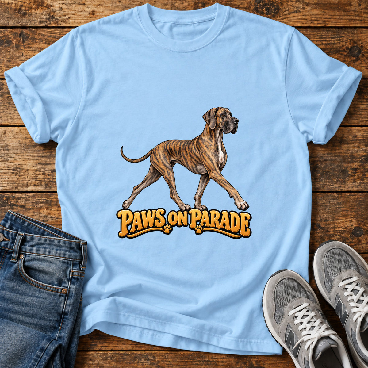 Paws On Parade Great Dane graphic T-shirt in Light Blue, shown on a flat-lay shirt mockup