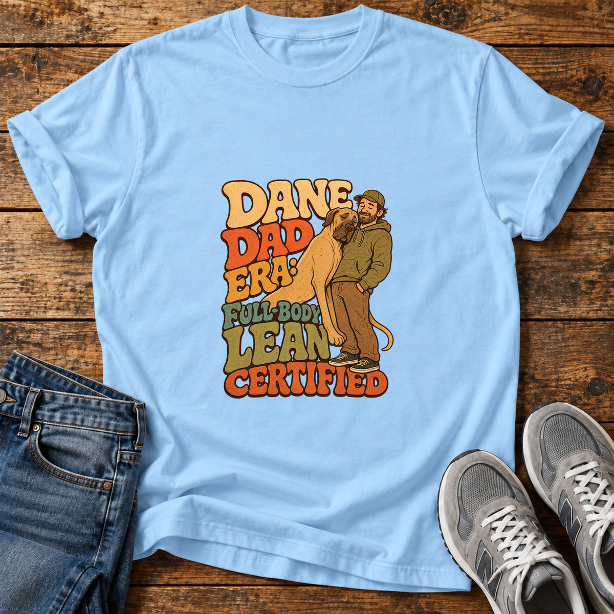 Dane Dad Certified Great Dane graphic T-shirt in Light Blue, shown on a flat-lay shirt mockup