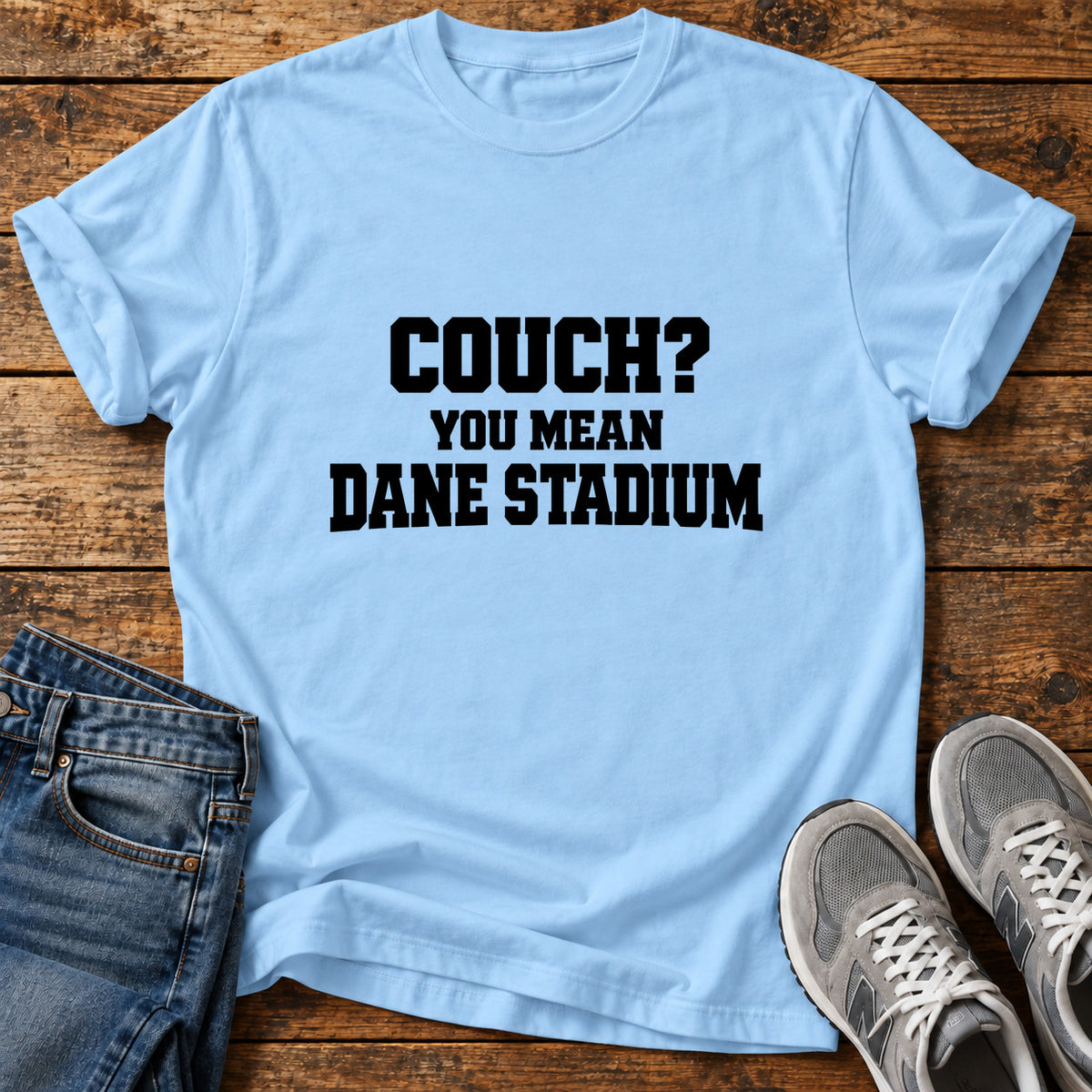 Couch Stadium Great Dane graphic T-shirt in Light Blue, shown on a flat-lay shirt mockup