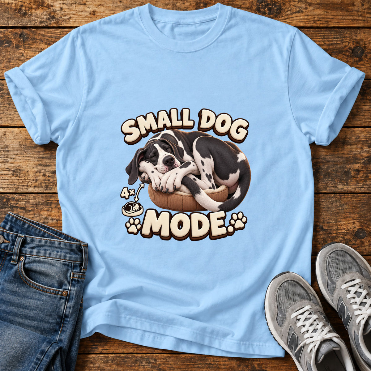 Small Dog Mode Great Dane graphic T-shirt in Light Blue, shown on a flat-lay shirt mockup
