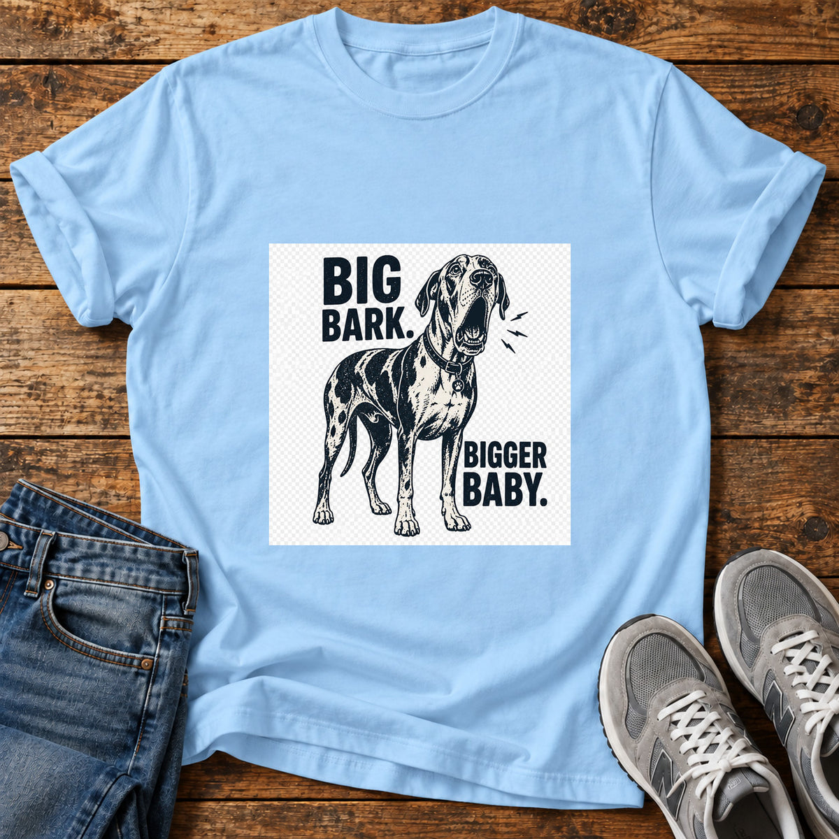 Big Bark Baby Great Dane graphic T-shirt in Light Blue, shown on a flat-lay shirt mockup