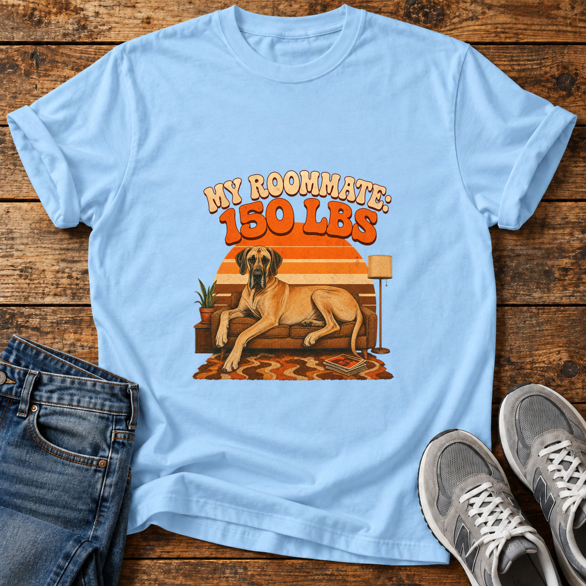 Roommate 150lbs Great Dane graphic T-shirt in Light Blue, shown on a flat-lay shirt mockup
