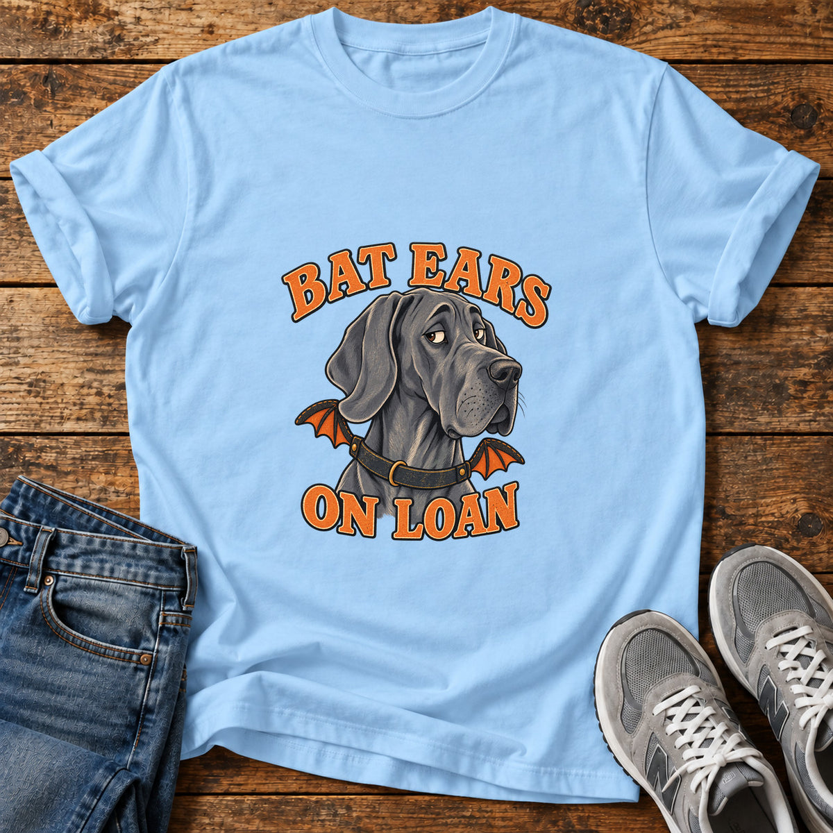 Bat Ears Loan Great Dane graphic T-shirt in Light Blue, shown on a flat-lay shirt mockup