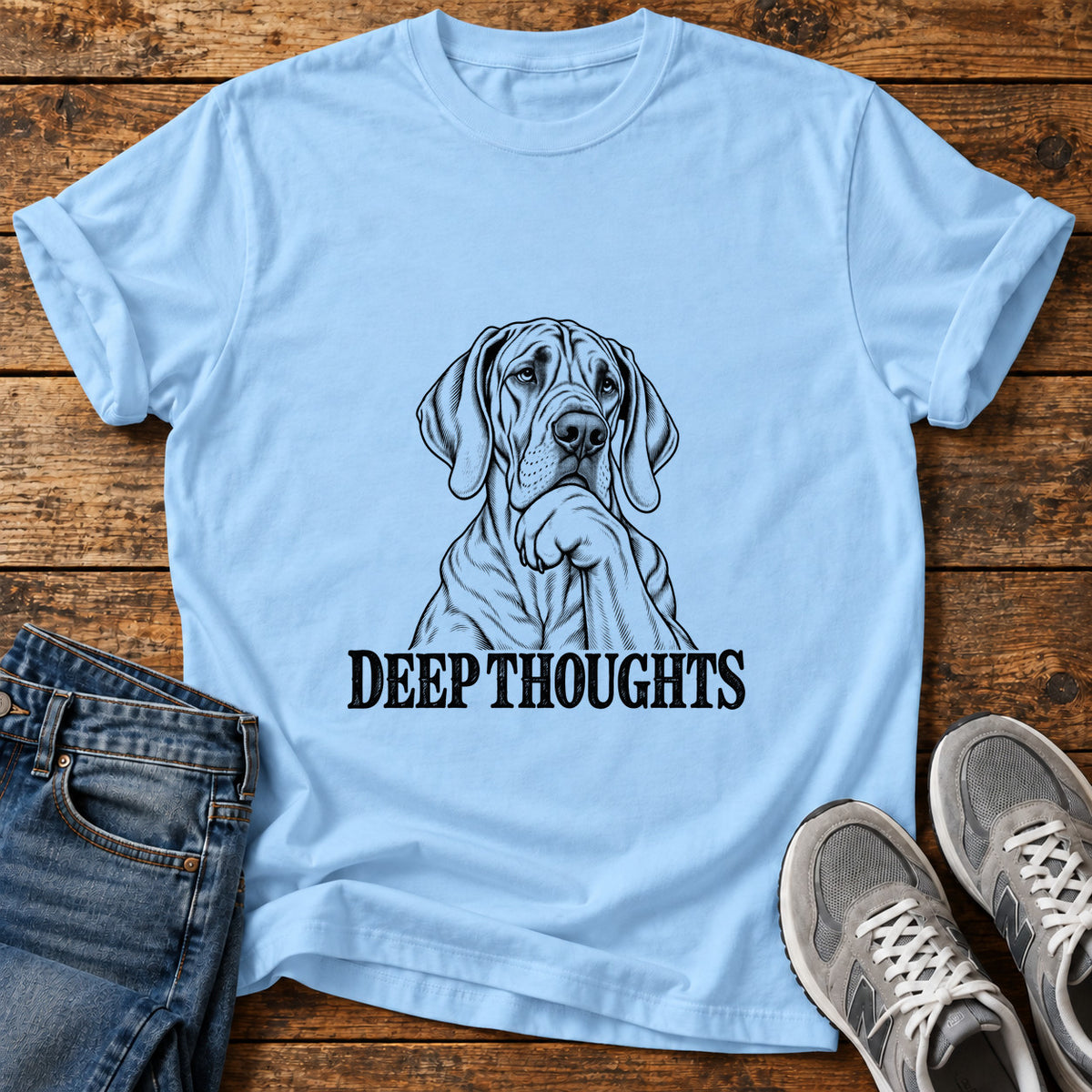 Deep Thoughts Great Dane graphic T-shirt in Light Blue, shown on a flat-lay shirt mockup