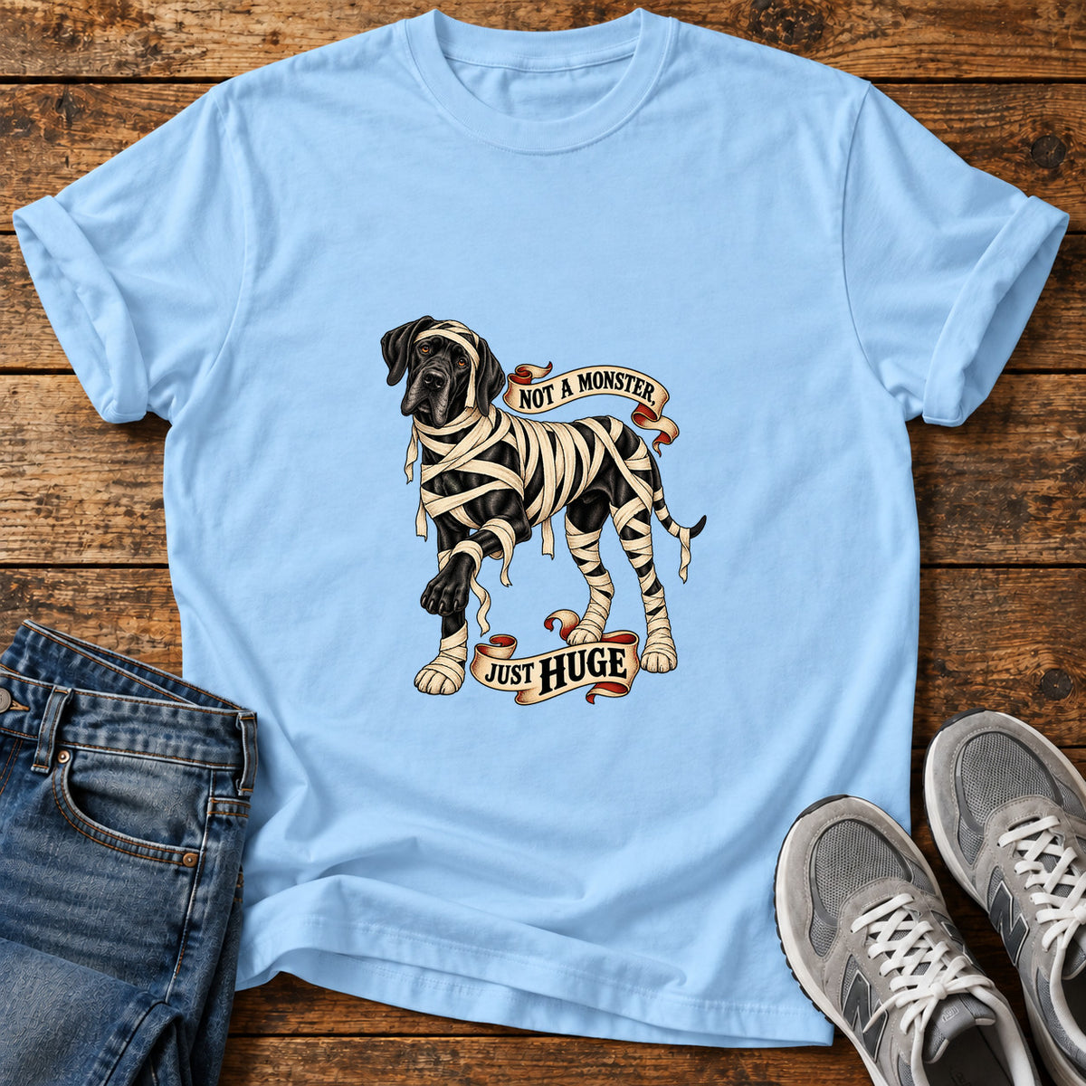 Not A Monster Great Dane graphic T-shirt in Light Blue, shown on a flat-lay shirt mockup