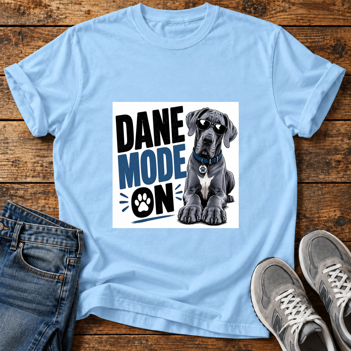 Dane Mode On Great Dane graphic T-shirt in Light Blue, shown on a flat-lay shirt mockup