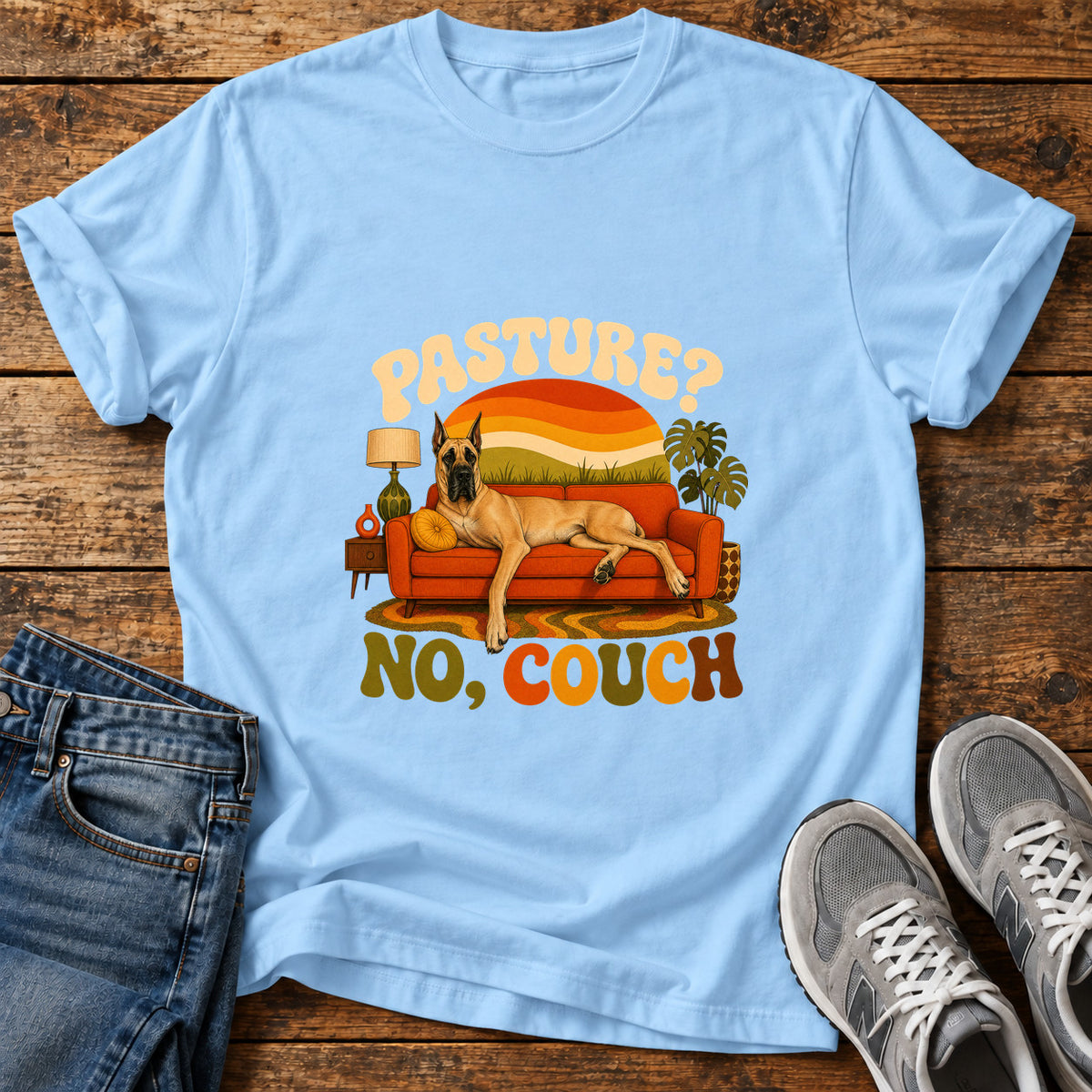 Pasture No Couch Great Dane graphic T-shirt in Light Blue, shown on a flat-lay shirt mockup
