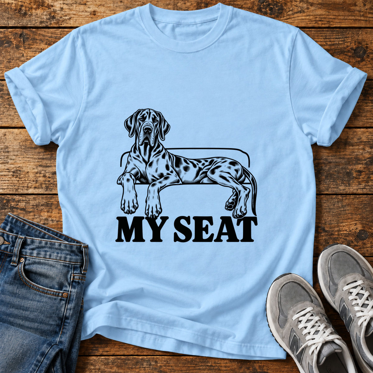 My Seat Great Dane graphic T-shirt in Light Blue, shown on a flat-lay shirt mockup