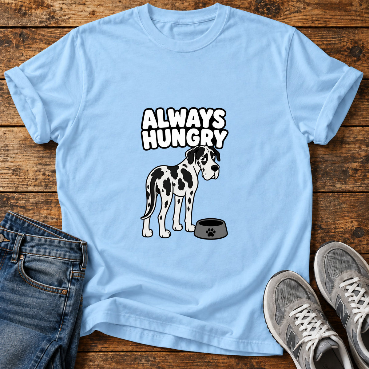 Always Hungry Great Dane graphic T-shirt in Light Blue, shown on a flat-lay shirt mockup