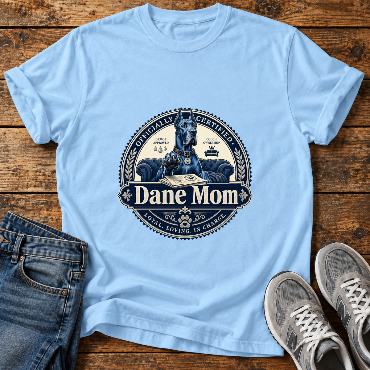 Dane Mom Great Dane graphic T-shirt in Light Blue, shown on a flat-lay shirt mockup