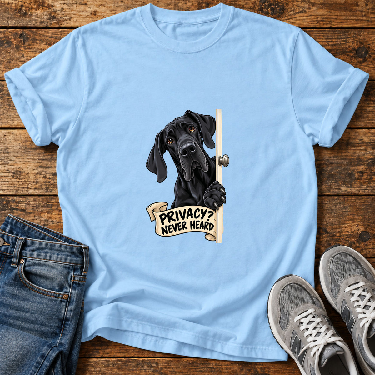 Privacy Pup Great Dane graphic T-shirt in Light Blue, shown on a flat-lay shirt mockup