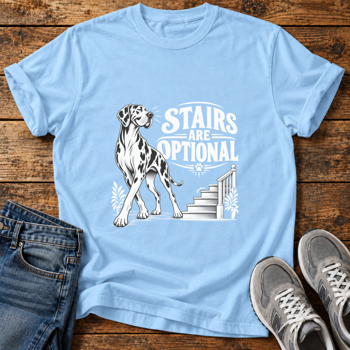 Stairs Optional Great Dane graphic T-shirt in Light Blue, shown on a flat-lay shirt mockup