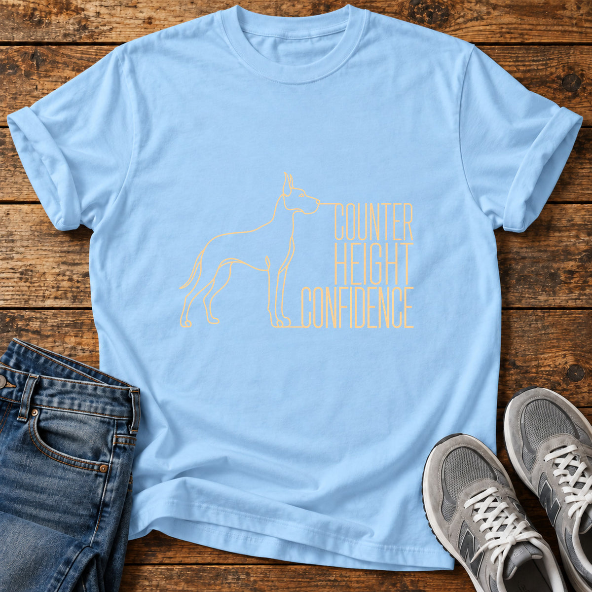 Counter Height Confidence Great Dane graphic T-shirt in Light Blue, shown on a flat-lay shirt mockup