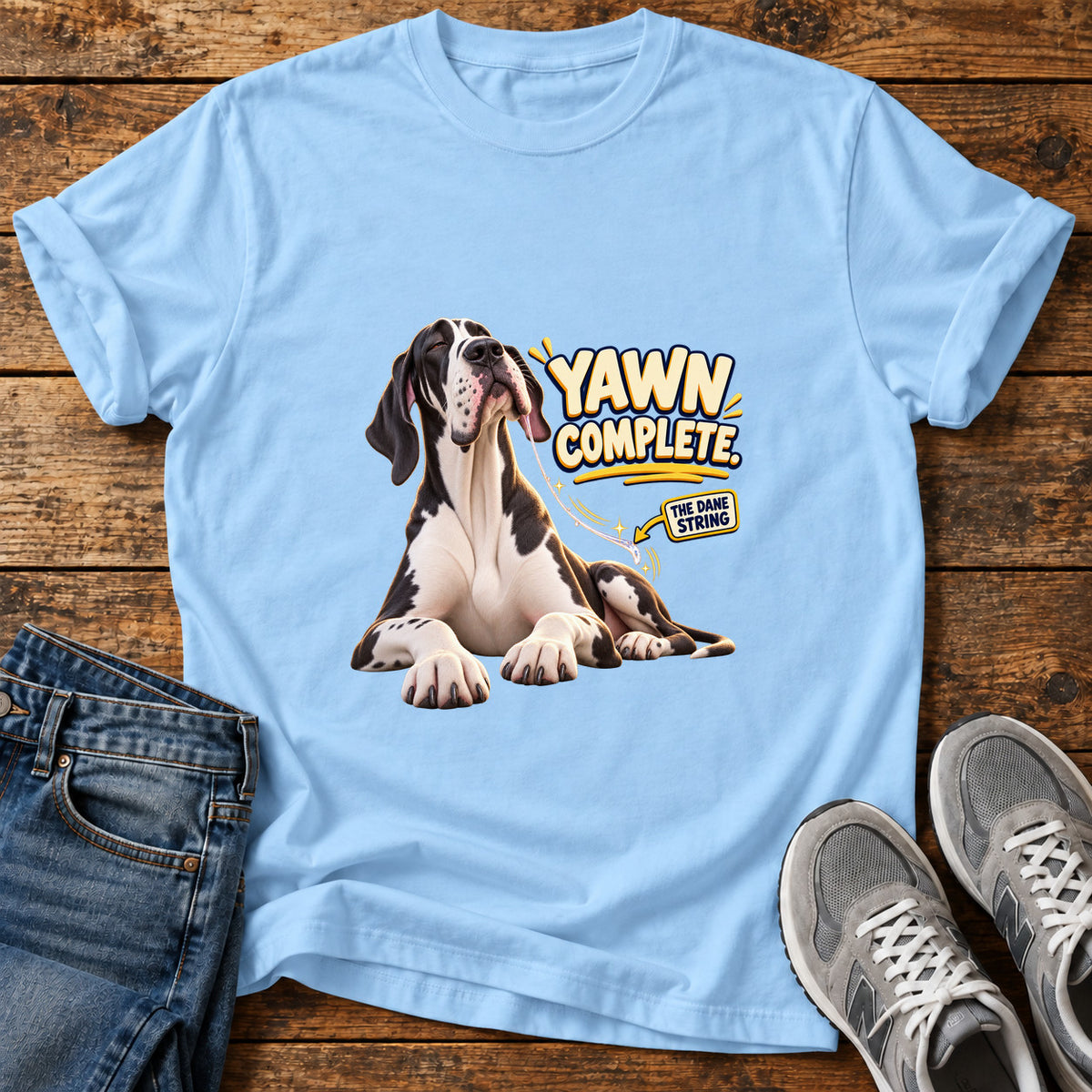 Yawn Complete Great Dane graphic T-shirt in Light Blue, shown on a flat-lay shirt mockup