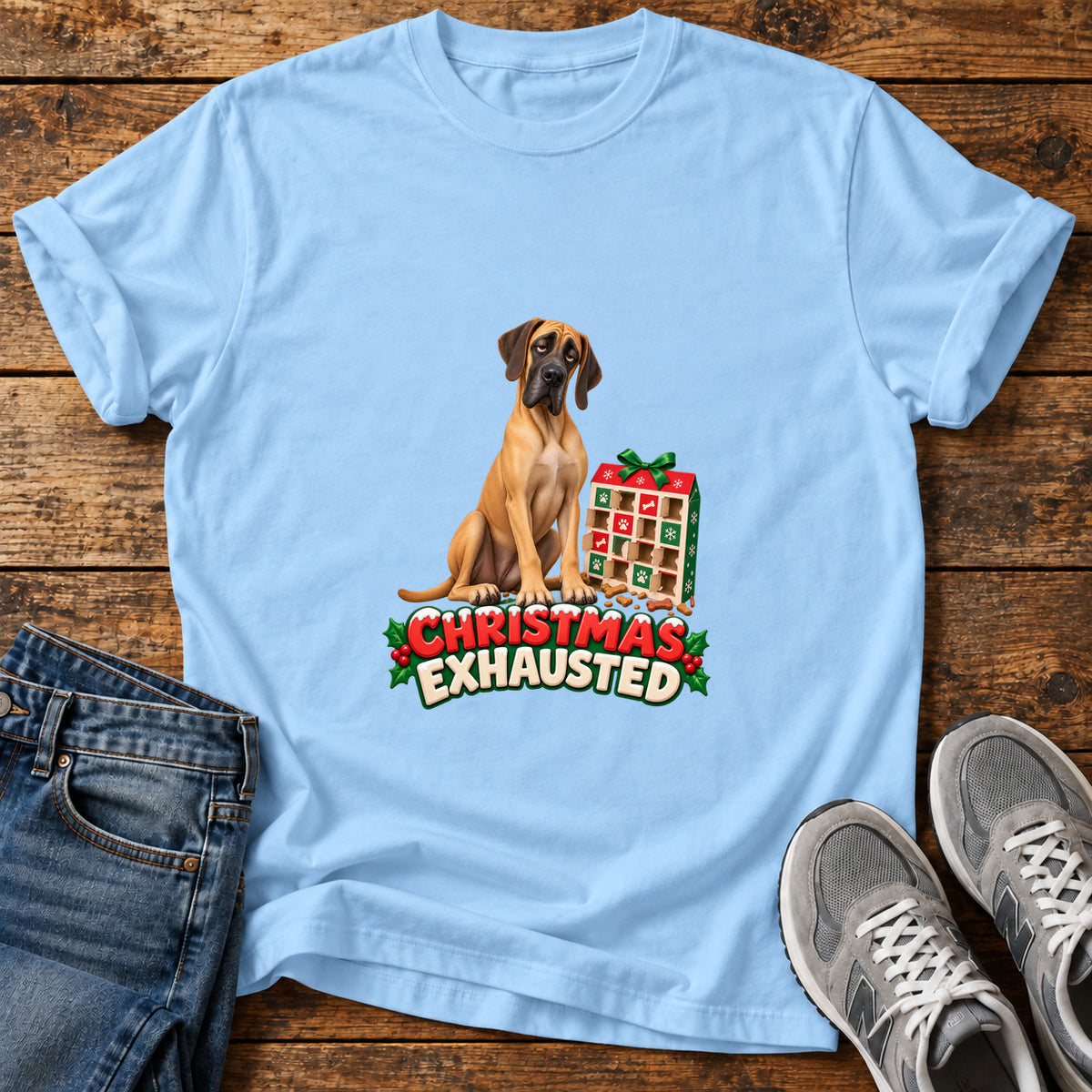 Christmas Exhausted Great Dane graphic T-shirt in Light Blue, shown on a flat-lay shirt mockup