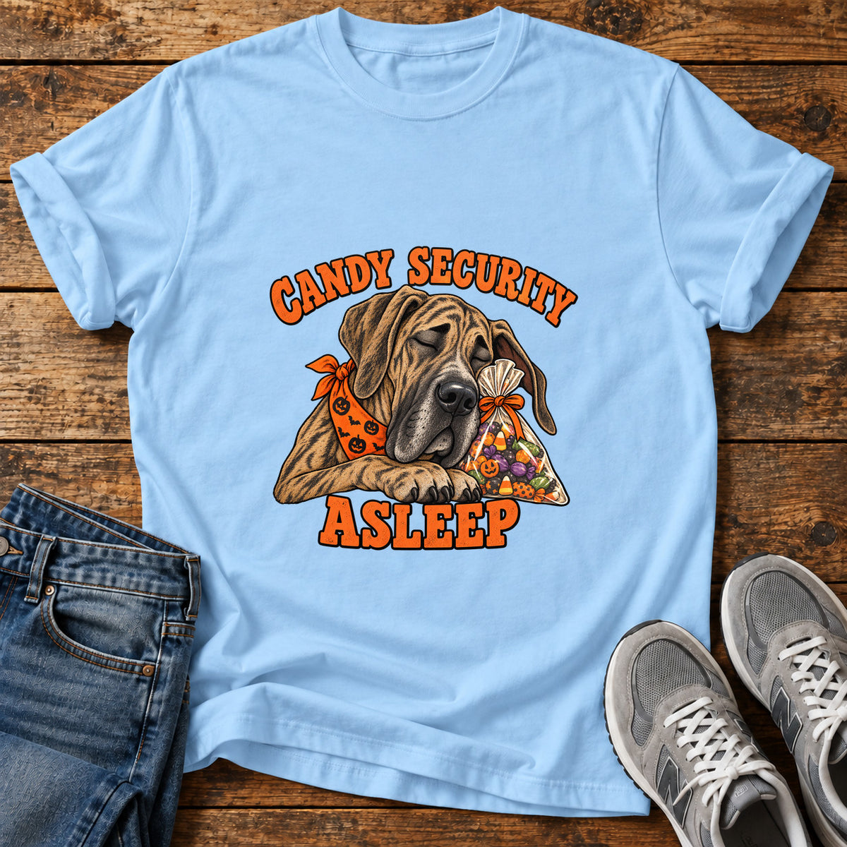 Candy Security Asleep Great Dane graphic T-shirt in Light Blue, shown on a flat-lay shirt mockup
