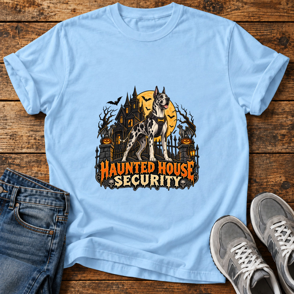 Haunted House Security Great Dane graphic T-shirt in Light Blue, shown on a flat-lay shirt mockup