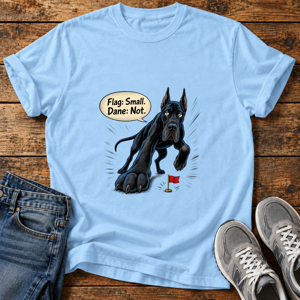 Small Flag, Big Great Dane graphic T-shirt in Light Blue, shown on a flat-lay shirt mockup