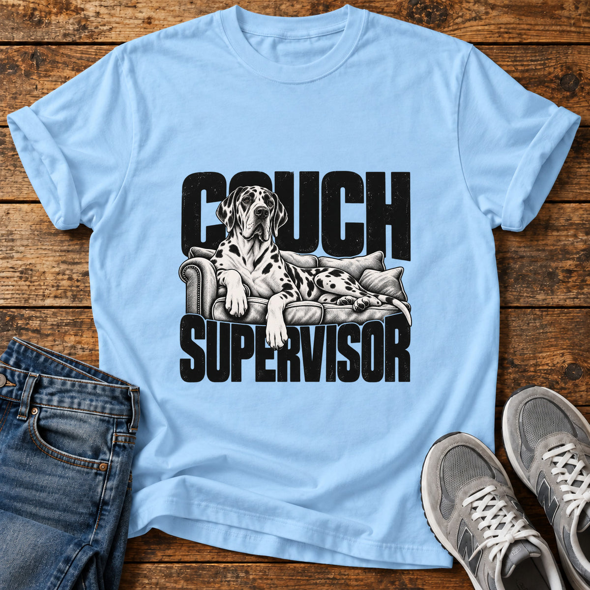 Couch Supervisor Great Dane graphic T-shirt in Light Blue, shown on a flat-lay shirt mockup